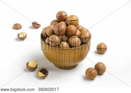 Natural Organic Macadamia Nuts In Wooden Bowl On Gray Concrete Background Flat Lay Top View Healthy 