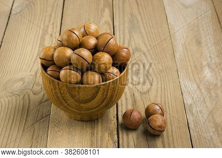 Natural Organic Macadamia Nuts In Bowl On Wooden Table Flat Lay Top View Healthy Snack Nuts Contain 
