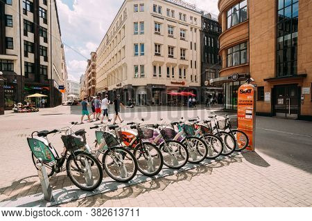 Riga, Latvia - July 2, 2016: Row Of Colorful Bicycles For Rent At Municipal Bike Parking In Kalku St