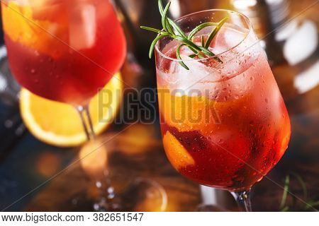 Milano Spritzer Italian Alcoholic Cocktail With Red Bitter, Dry White Wine, Soda, Zest And Ice. Blue