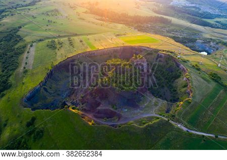 Aerial view of  Racos volcanic crater in the sunrise, Brasov county, Romania 
