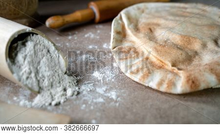 Kuboos Or Khubz - Arabic Bread On A Brown Table In The Kitchen