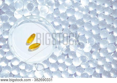 Omega3 Gel Capsules. Yellow Vitamin. Dietology Drug. Fish Oil Supplement. Microdosing Concept. Golde