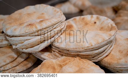 Kuboos Or Khubz - Fresh Pita Bread Togeather In A Table Table