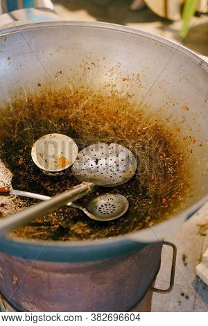 They Ate All The Pilaf. Empty Large Cauldron For Pilaf With Beds For Stirring And Putting Rice In Pl