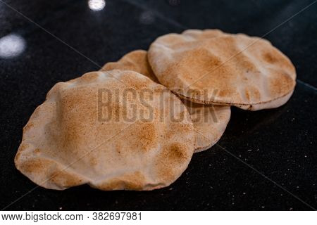 Kuboos Or Khubz - Fresh Pita Bread Togeather In A Table Table