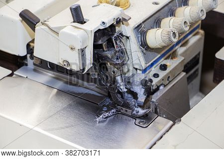 Four-thread Industrial Sewing Machine Overlock. An Overlock Is A Type Of Stitch That Sews Along The 