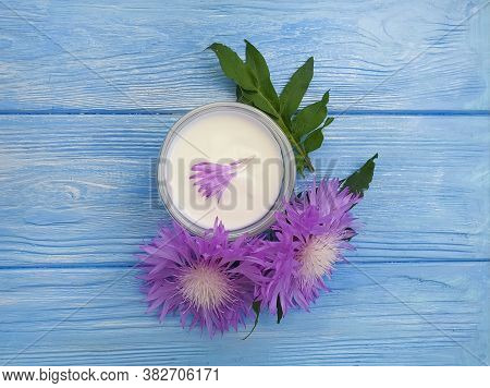 Cream Cosmetic Flower On Wooden Background Echinacea