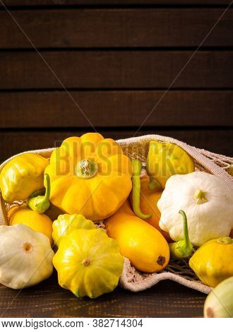 Fresh Harvest Of Zucchini And Pattypan Squash, Yellow Squash And Pattison And Pepper On Wooden Backg