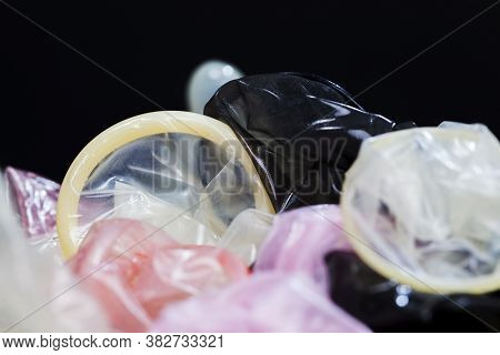 High-quality Pink Latex Condom, A Means To Prevent Pregnancy And Infection, Close-up And Small Depth