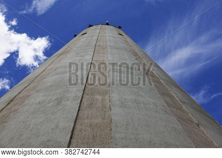 Lovanger, Norrland Sweden - August 2, 2020: Water Tower Seen From The Ground With Summer Sky