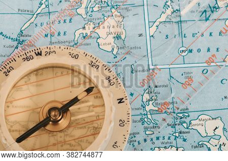 Old Transparent Plastic Sport Compass With Azimuth Measurement On Old Map Background