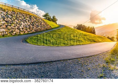 Sharp Hairpin Curve Of Narrow Rural Asphalt Road In The Mountains. Austrian Alps, Austria.