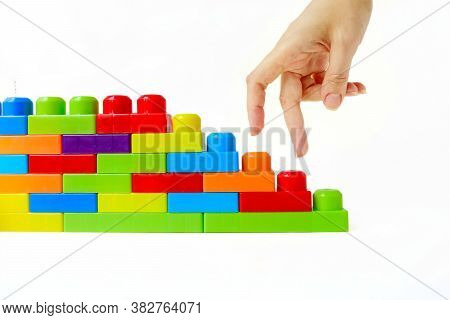 Step By Step To The Top. Business Concept Of Successful Financial Growth. The Womans Hand Steps On T