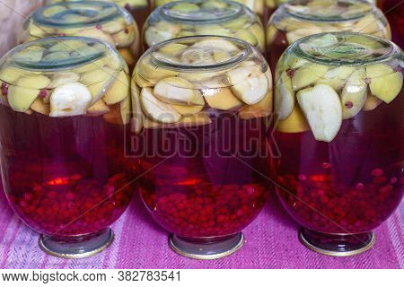 Homemade Canned Fruit Compote For The Winter. Compot From Apples And Red Currant. Inverted Jars