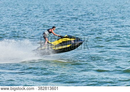 Voronezh, Russia - 23.08.2019 - Man On Water Scooter. Splashes And Drops Around. Summer Vacation On 