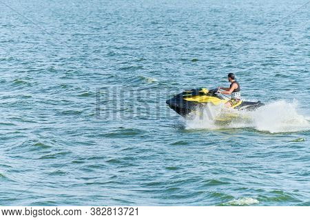 Voronezh, Russia - 23.08.2019 - Man On Water Scooter. Summer Vacation On Personal Watercraft In Trop