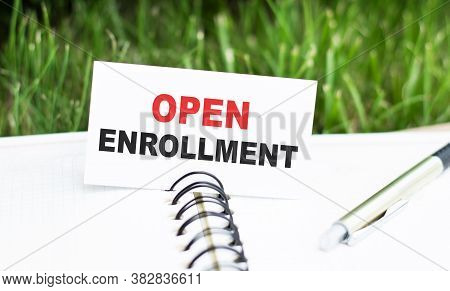 Open Enrollment Words On A Card In A Notebook