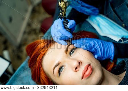 Permanent Make-up Od Tattoo On Eyebrows At Beauty Salon. Woman Having Her Eyebrows Tinted. Semi-perm