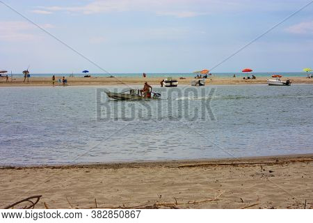 Glimpse Of Sea And River Among The Nature Of Marina Di Pisa In The Tuscan Serenity Of The Italian Su