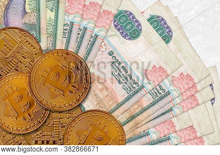 1000 Sri Lankan Rupees Bills And Golden Bitcoins. Cryptocurrency Investment Concept. Crypto Mining O