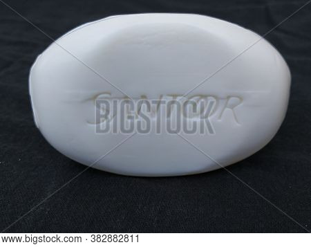 Closeup Of Pack Opened And Closed White Color Santoor Sandal And Almond Milk Soap Bar Isolated On Bl