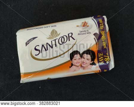 Closeup Of Pack Opened And Closed White Color Santoor Sandal And Almond Milk Soap Bar Isolated On Bl