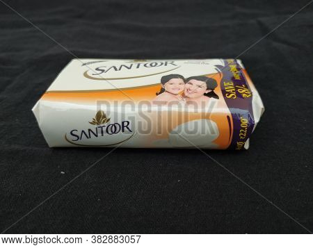 Closeup Of Pack Opened And Closed White Color Santoor Sandal And Almond Milk Soap Bar Isolated On Bl