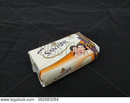 Closeup Of Pack Opened And Closed White Color Santoor Sandal And Almond Milk Soap Bar Isolated On Bl