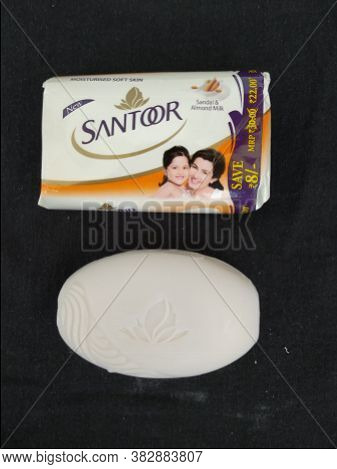 Closeup Of Pack Opened And Closed White Color Santoor Sandal And Almond Milk Soap Bar Isolated On Bl
