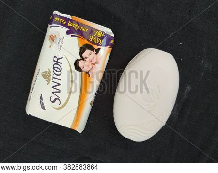 Closeup Of Pack Opened And Closed White Color Santoor Sandal And Almond Milk Soap Bar Isolated On Bl
