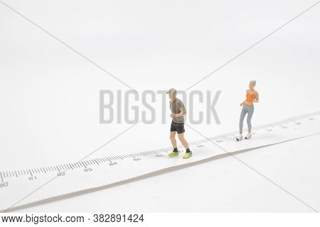 A Mini People Couple Running On White Background