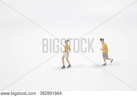 A Mini People : Couple Running On White Background