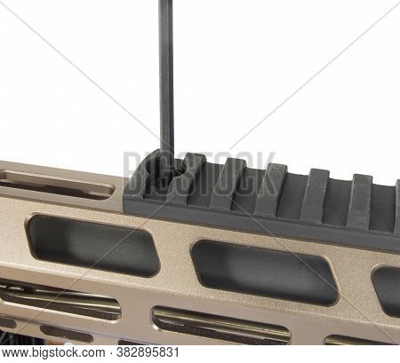 Rail Being Installed On An Ar-15 With Oblong Holes In Its Hand Guard