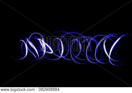 Abstract Neon Lights Trails In The Black Background. Futuristic Overlay Light Pattern.