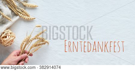 Erntedankfest Means Thanksgiving In German Language. Panoramic Flat Lay With Golden Wheat Ears On Wh