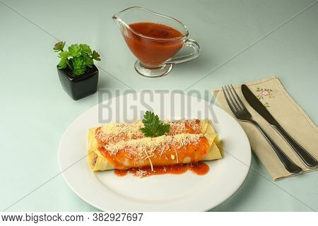 Delicious Meat Pancake With Red Sauce And Parmesan Cheese