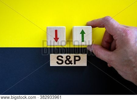 Businessman Holds A Cubes With Green Arrow Symbolizing That The Sp500 Index Is Changing The Trend An