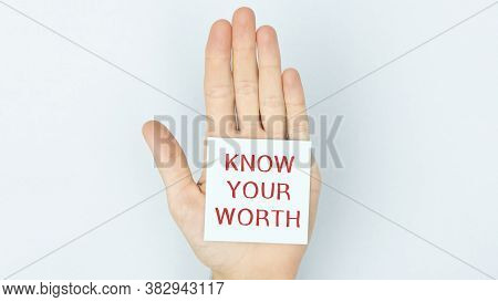 Hand Writing Know Your Worth With Blue Marker On Transparent Wipe Board. Self-esteem Concept.