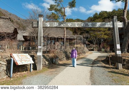 Yamanashi, Nenba, Lake Saiko, Japan - February 29, 2020: Woman Tourist Wearing A Surgical Mask At Th