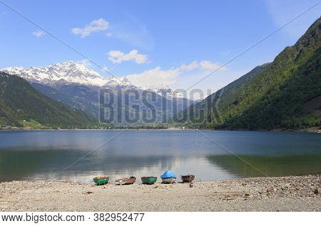 Lago Di Poschiavo, A Natural Lake In The Poschiavo Valley In The Canton Of Grisons, Switzerland.