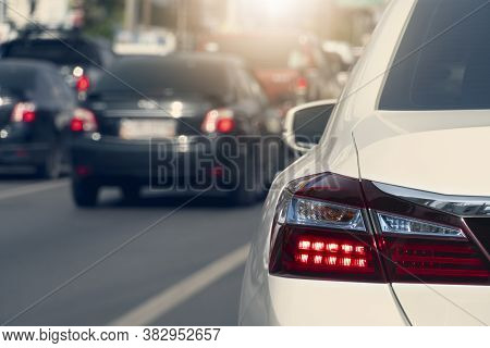 Transportation Of Wihte Car On The Road. Open Light Break. Drive A Car To Travel Or Work. On The Asp