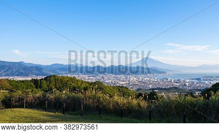 Mt. Fuji / Fuji Mountain And Shimizu Industrial Port Over Blue Sky At Nihondaira, Shizuoka, Japan