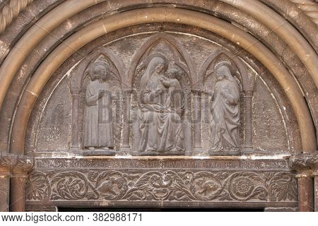 ZADAR, CROATIA - AUGUST 11, 2013: Gothic relief of the Virgin and Child, on the right is St Anastasia, and to the left St Chrysogonus, Cathedral of St Anastasia in Zadar, Croatia