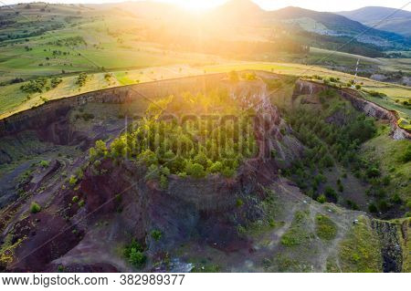 Aerial view of  Racos volcanic crater in the sunrise, Brasov county, Romania 