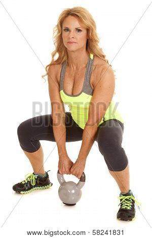 Mature Woman Green With Kettle Bell Squat