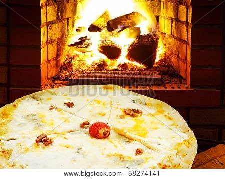 Pizza Quatro Formaggi And Open Fire In Oven