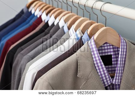 Man Suits In A Closet