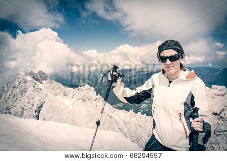 Young Woman Ascending A Mountain