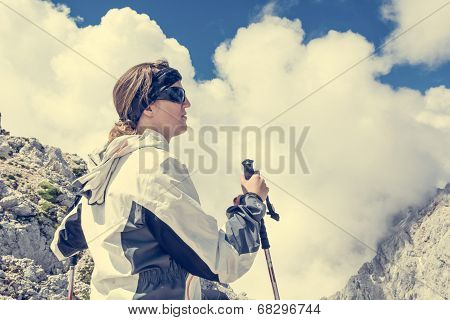 Female Looking At Cloud Covered Mountains